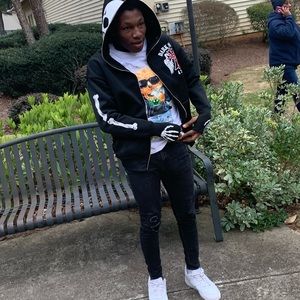 A Zip Up hoodie with design on front and back